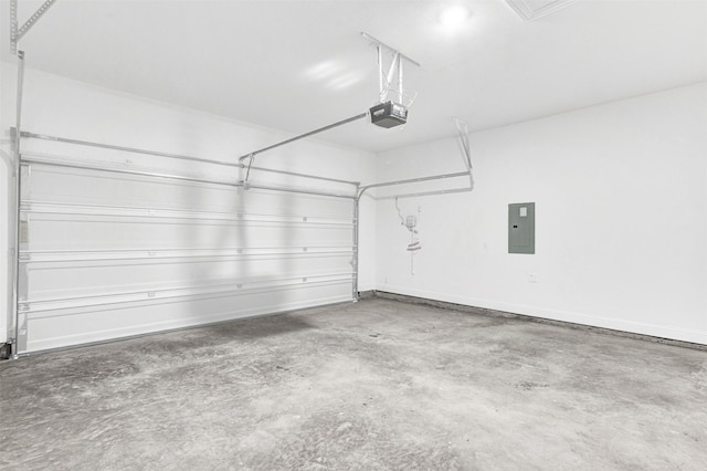 garage with electric panel and a garage door opener