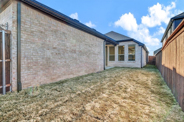 view of property exterior featuring a lawn