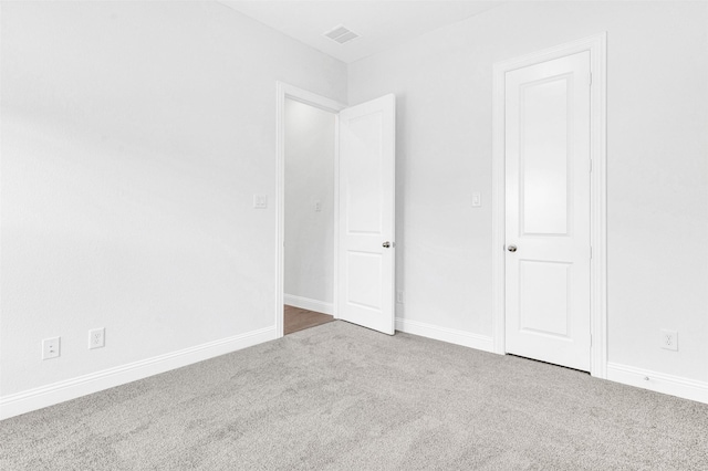 unfurnished bedroom with carpet flooring