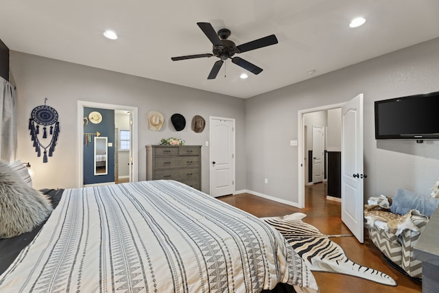 bedroom with ceiling fan and dark hardwood / wood-style flooring