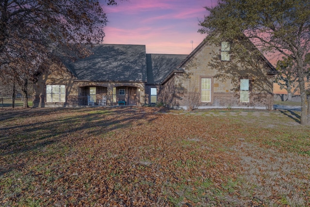 view of front of property with a yard