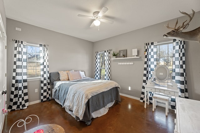 bedroom featuring multiple windows and ceiling fan