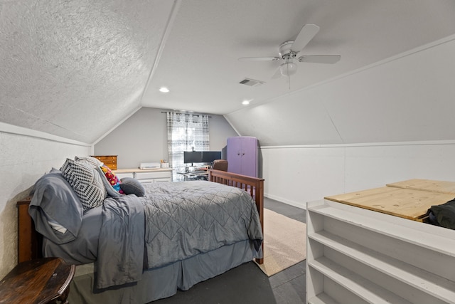 bedroom featuring a textured ceiling, ceiling fan, and vaulted ceiling