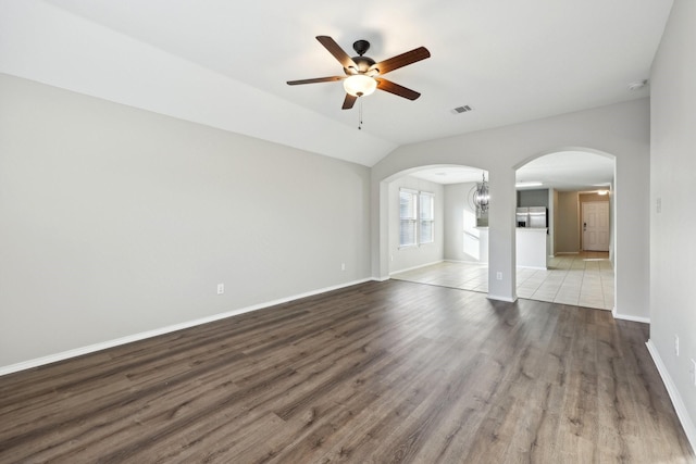 unfurnished living room with wood-type flooring, ceiling fan, and lofted ceiling