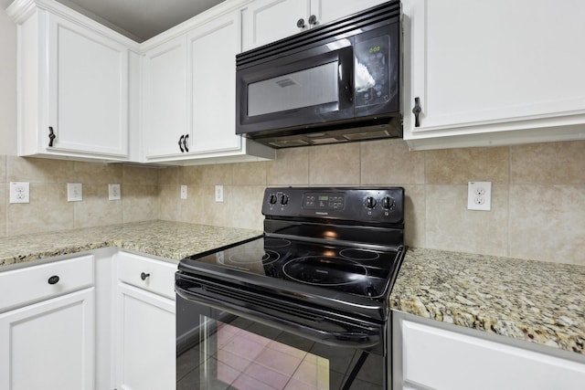 kitchen with white cabinetry, light stone counters, backsplash, tile patterned floors, and black appliances