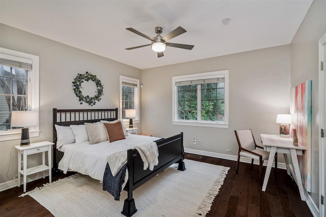 bedroom featuring ceiling fan and dark hardwood / wood-style floors