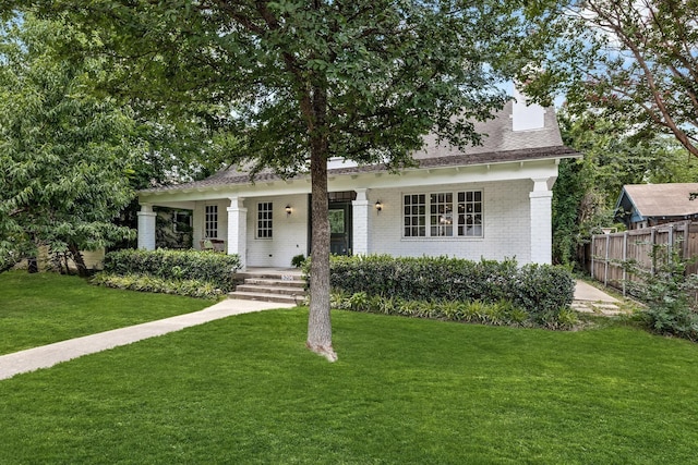 view of front of home featuring a front lawn and a porch