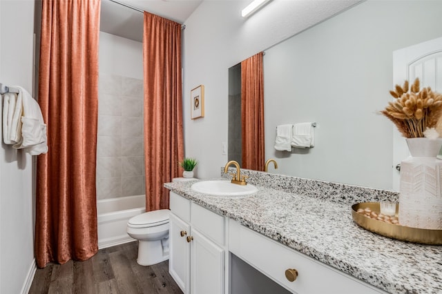 full bathroom with toilet, vanity, shower / bath combo, and hardwood / wood-style flooring