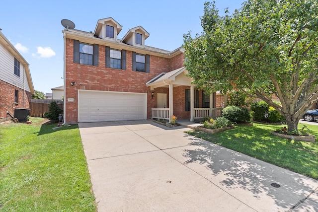 view of front of property featuring central air condition unit, a front yard, a porch, and a garage