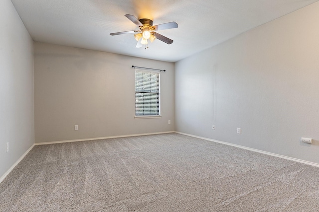 spare room with carpet and ceiling fan