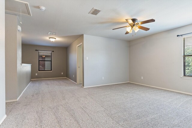 unfurnished room with light carpet and ceiling fan