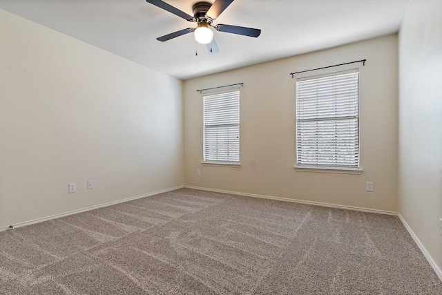 empty room with carpet floors and ceiling fan