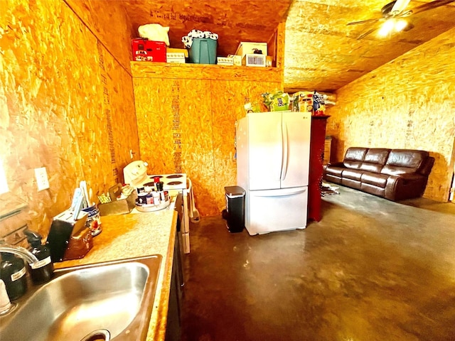 kitchen with ceiling fan, sink, and white fridge