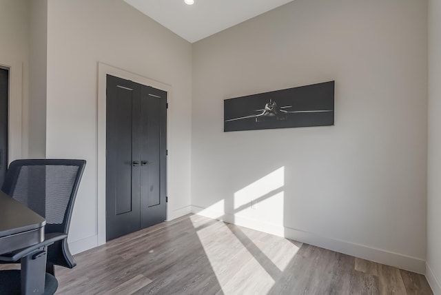 office space with light hardwood / wood-style flooring