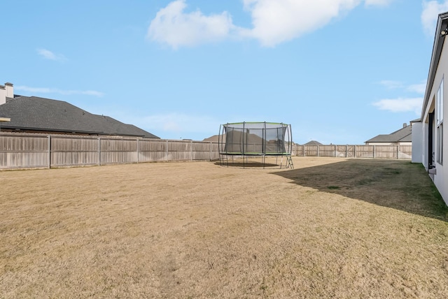 view of yard featuring a trampoline