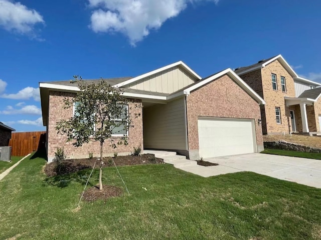 view of front of house with central AC unit, a garage, and a front lawn