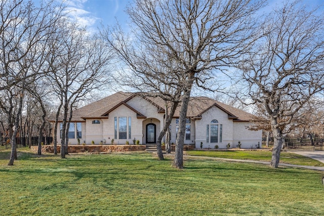 view of front of property with a front lawn