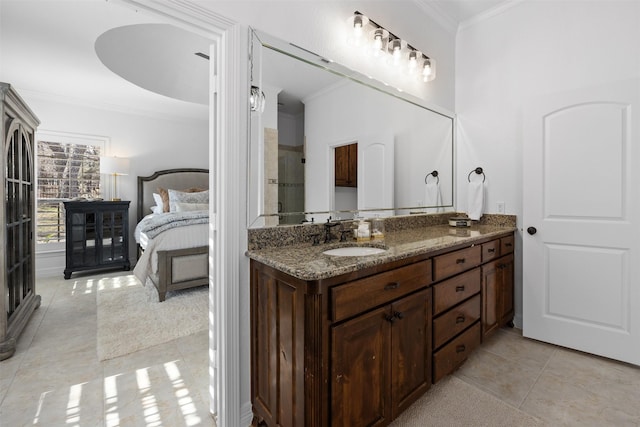 bathroom with vanity, tile patterned flooring, crown molding, and a shower with shower door