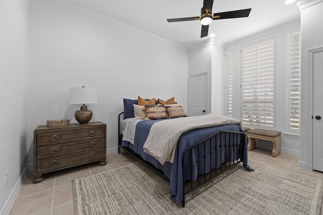 bedroom featuring multiple windows, light tile patterned floors, ceiling fan, and crown molding