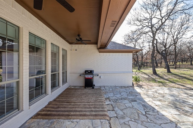 view of patio with area for grilling and ceiling fan