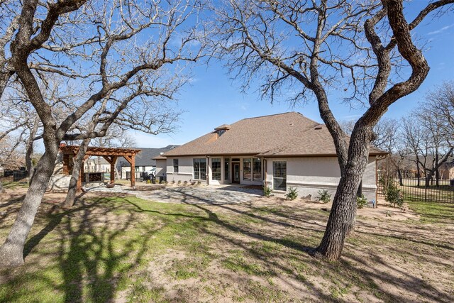 back of property featuring a pergola