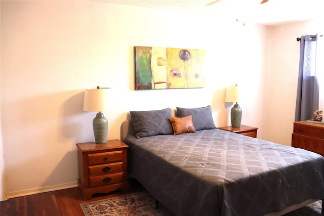 bedroom featuring dark hardwood / wood-style flooring