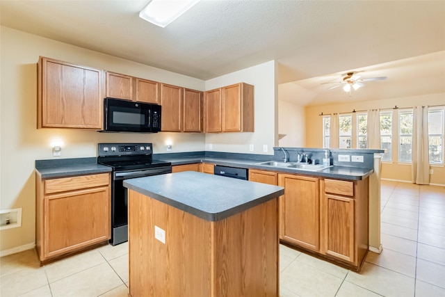 kitchen with sink, light tile patterned floors, a center island, and black appliances