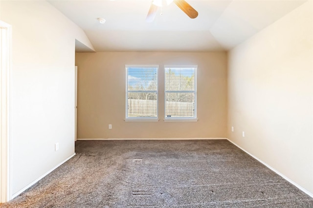 unfurnished room featuring ceiling fan, vaulted ceiling, and carpet