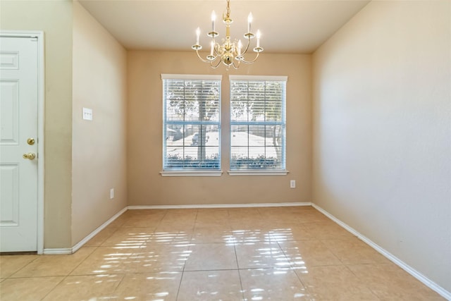 unfurnished dining area with tile patterned floors and a chandelier