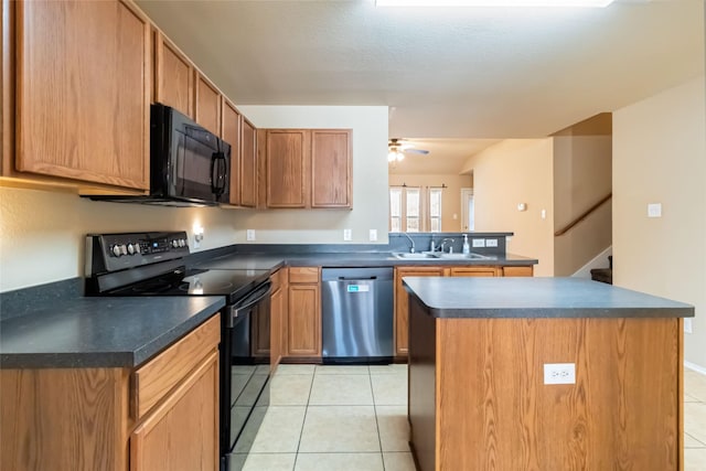 kitchen featuring light tile patterned floors, black appliances, a kitchen island, ceiling fan, and sink