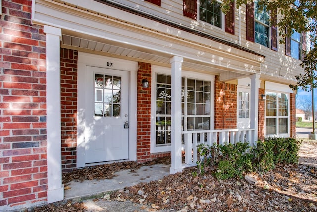 property entrance with covered porch