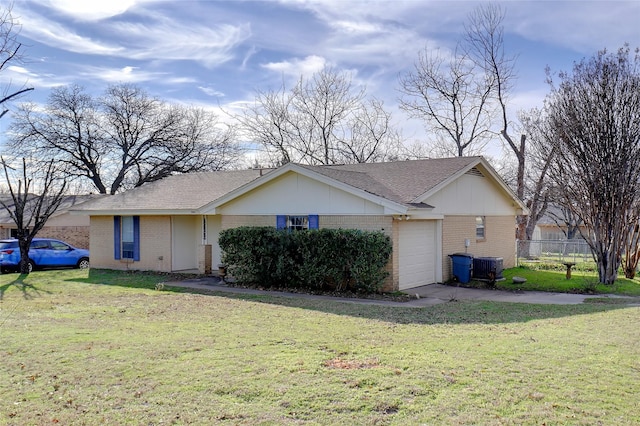 view of front facade featuring a front yard, a garage, and cooling unit