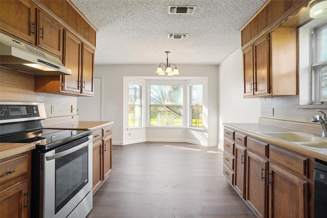 kitchen with sink, a notable chandelier, dishwasher, stainless steel electric range oven, and hanging light fixtures