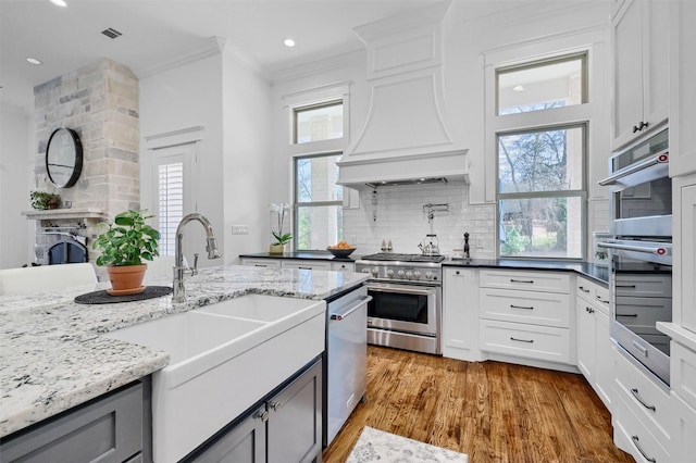 kitchen featuring white cabinets and appliances with stainless steel finishes