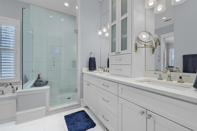 bathroom featuring vanity, tile patterned floors, and independent shower and bath