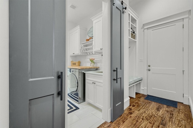 interior space featuring washer / dryer and light wood-type flooring