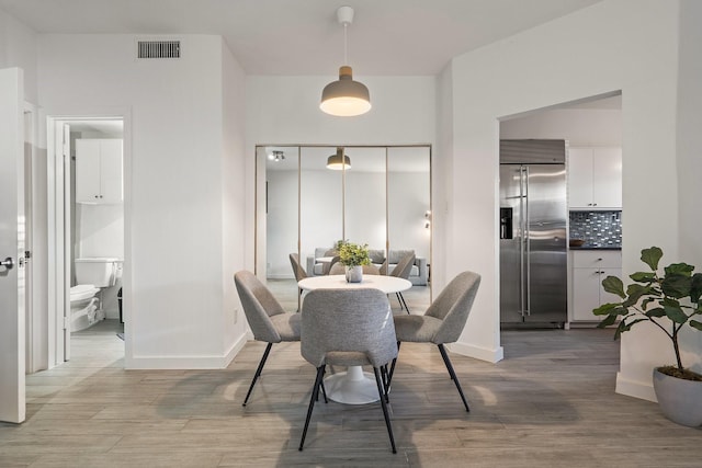 dining area featuring hardwood / wood-style flooring