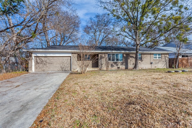 ranch-style house with a garage and a front lawn