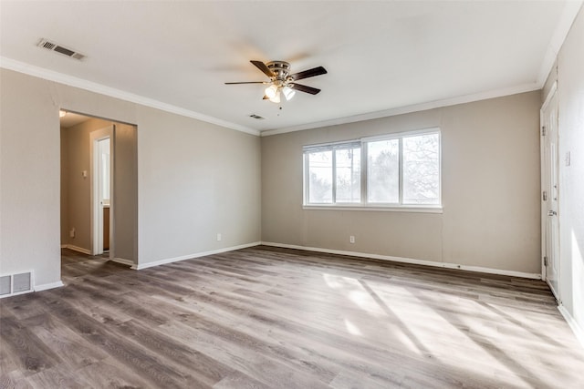 unfurnished room featuring hardwood / wood-style floors, ornamental molding, and ceiling fan