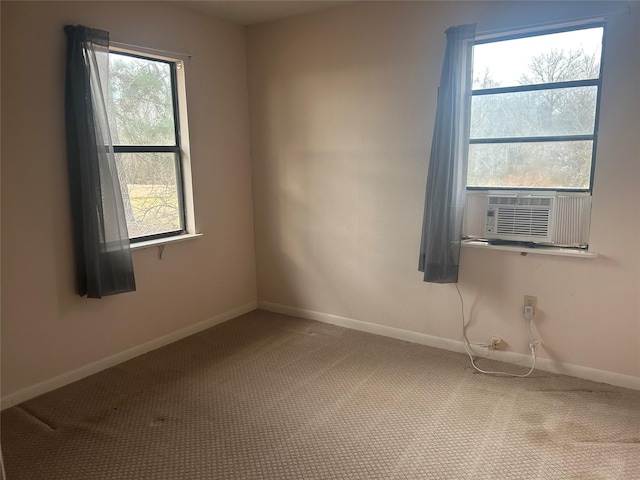 carpeted spare room with cooling unit