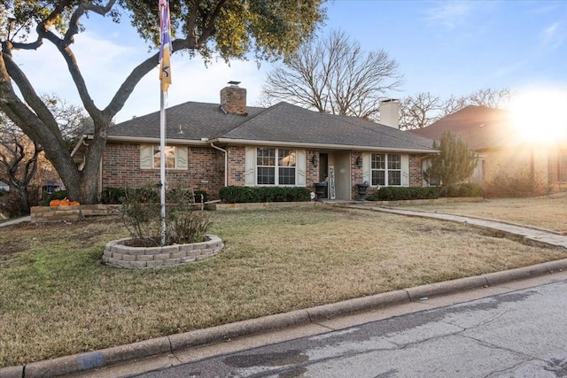 ranch-style home with a front lawn