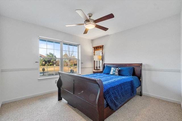 bedroom with light colored carpet and ceiling fan