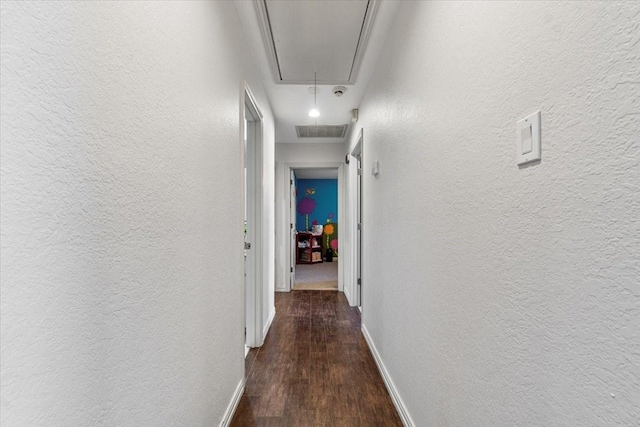 corridor featuring dark hardwood / wood-style flooring