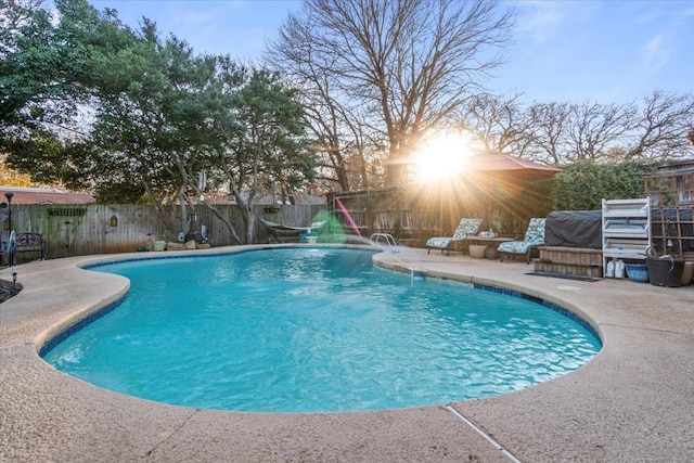 view of swimming pool with a patio area