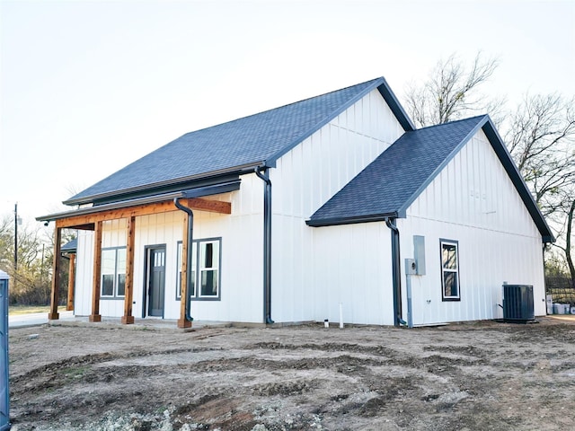 exterior space featuring cooling unit and a porch