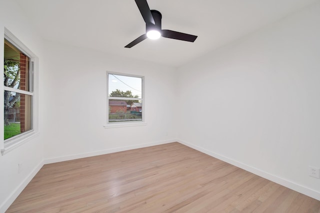 empty room with light hardwood / wood-style flooring and ceiling fan