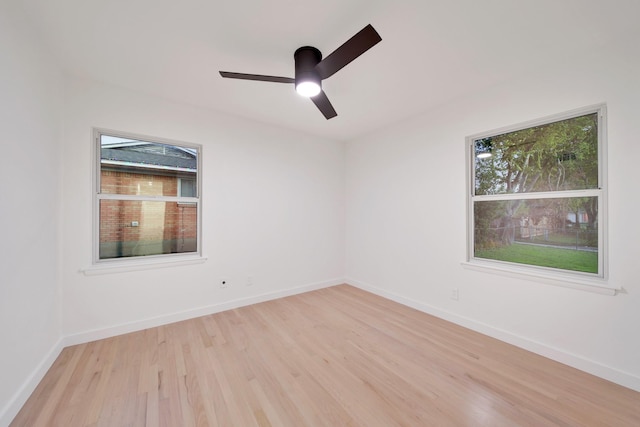 spare room featuring ceiling fan and light wood-type flooring