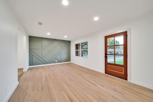 unfurnished room featuring light hardwood / wood-style flooring