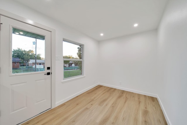 doorway with light wood-type flooring