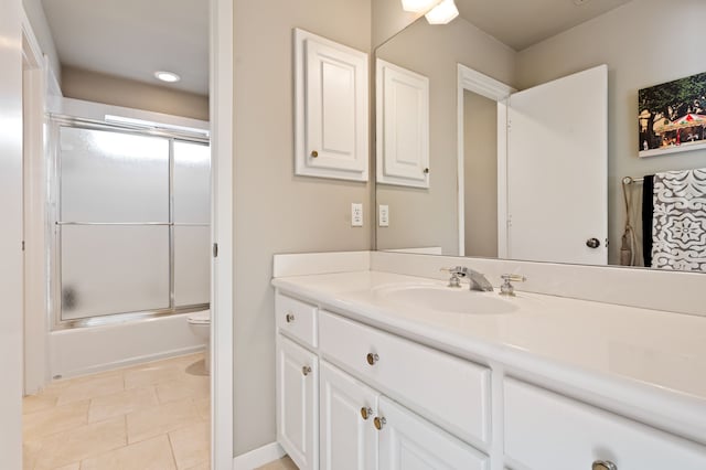 full bathroom with tile patterned flooring, vanity, shower / bath combination with glass door, and toilet